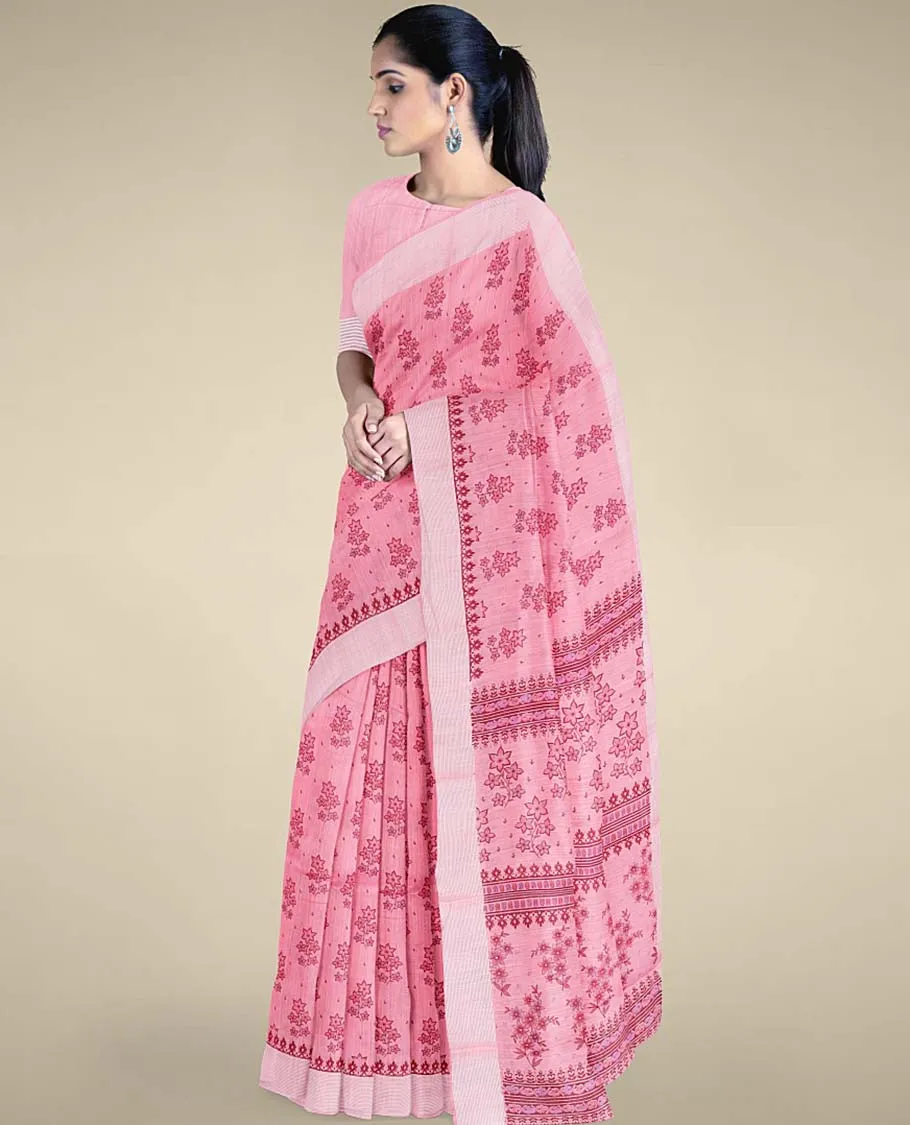 Pink budget cotton saree with unique buttas, self-border & pallu of floral designs