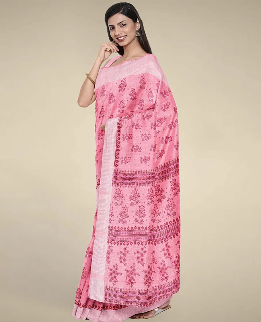 Pink budget cotton saree with unique buttas, self-border & pallu of floral designs